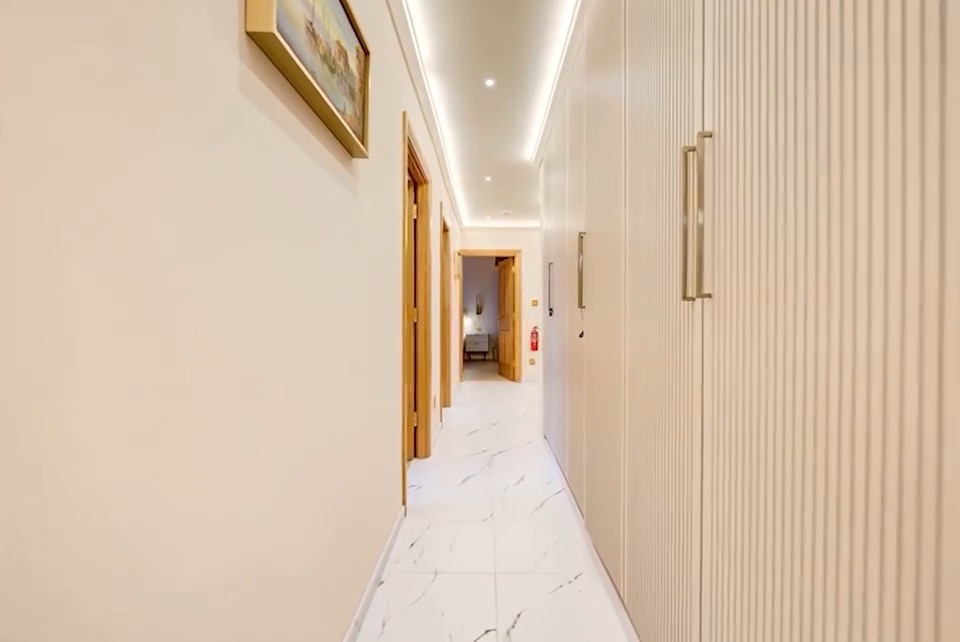 A long corridor with every door along it in line.
